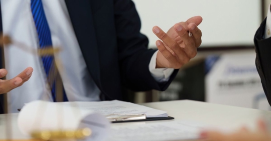 businessman discussing with lawyer